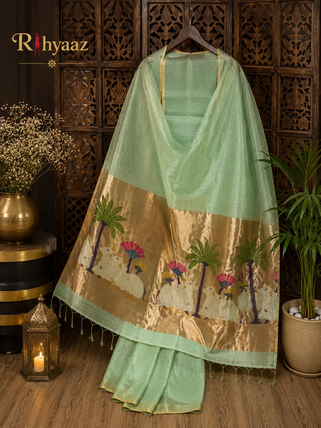 Kamdhenu Silk Linen Pichwai Motif Paithani Jamdani Saree by Rihyaaz featuring intricate Pichwai-inspired weaving, elegant Paithani pallu, handcrafted details, and a plain blouse piece for festive and traditional wear.