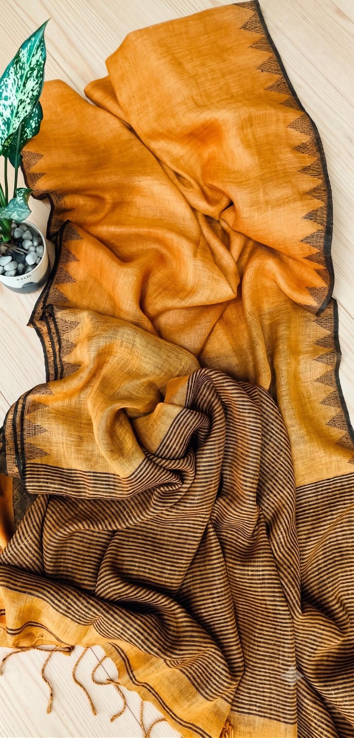 Mustard Yellow Pure silk Jayashree linen saree with traditional temple border, striped palla and running blouse piece by Rihyaaz Fashions.