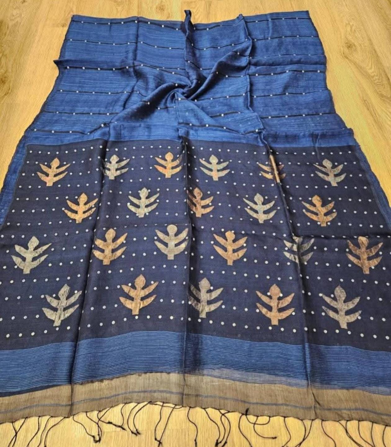 Taru Matka Muslin Silk saree with gold and silver zari motifs on pallu and white sequin sea-shell weave on body and palla by Rihyaaz