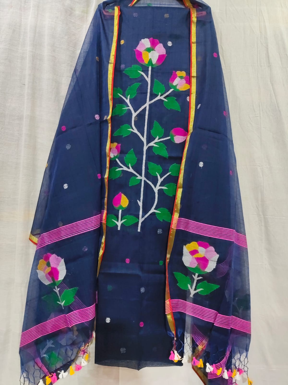 Petunia needle-woven Jamdani Muslin suit set by Rihyaaz, featuring a 2.5-meter top and 2.5-meter dupatta with elegant tassel detailing, showcasing traditional handloom craftsmanship and timeless ethnic style.