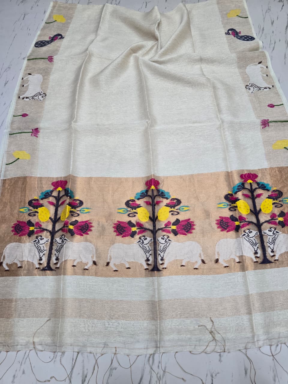 Suravi Silk Linen Pichwai Inspired Jamdani Saree by Rihyaaz featuring intricate handwoven Pichwai-inspired motifs on premium silk linen fabric, ideal for festive, wedding, and ethnic wear.