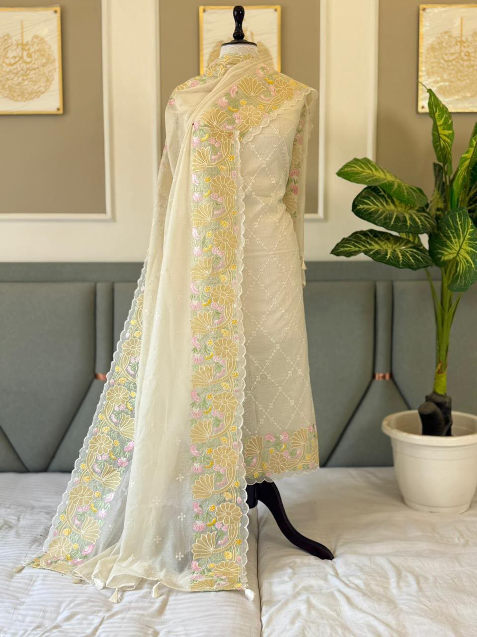 Exclusive off white Banarasi Mal Chanderi tissue suit set by Rihyaaz Fashions featuring an embroidered appliqué work top, matching tissue dupatta and plain cotton silk bottom, 2.5 metres each.