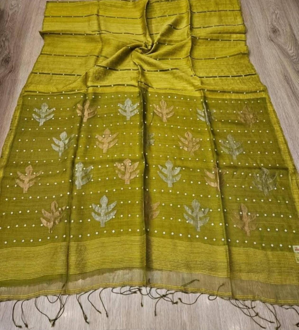 Taru Matka Muslin Silk saree with gold and silver zari motifs on pallu and white sequin sea-shell weave on body and palla by Rihyaaz