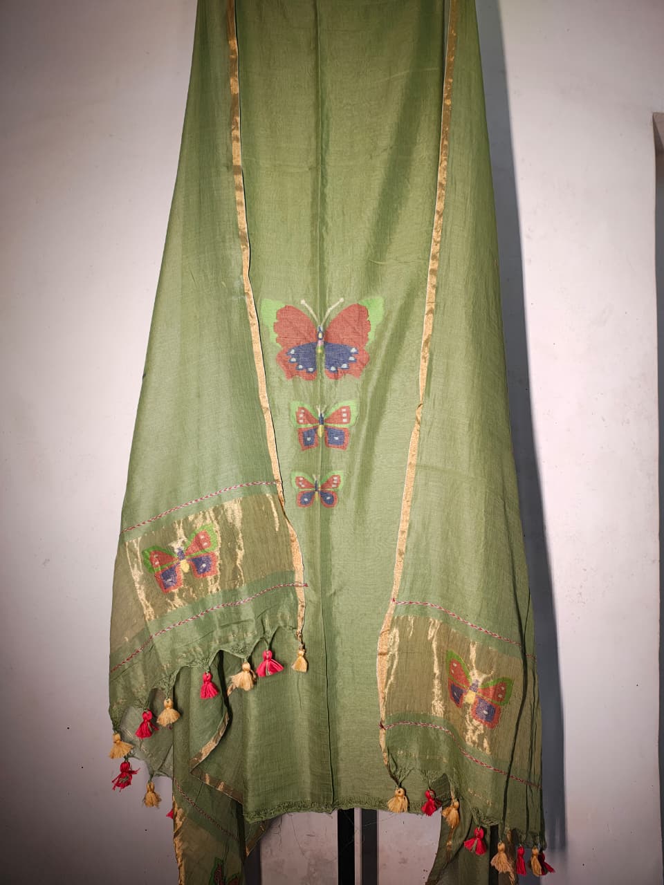 Titli trio zari handwoven Mul Cotton suit with delicate butterfly motifs and elegant zari detailing for a refined royal look by Rihyaaz 