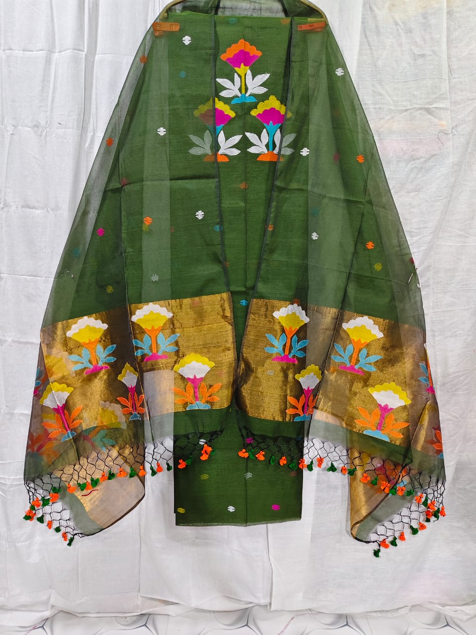 Rihyaaz muslin suit with 2.5 meter top and tasselled 2.5 meter dupatta, elegant ethnic Indian wear.