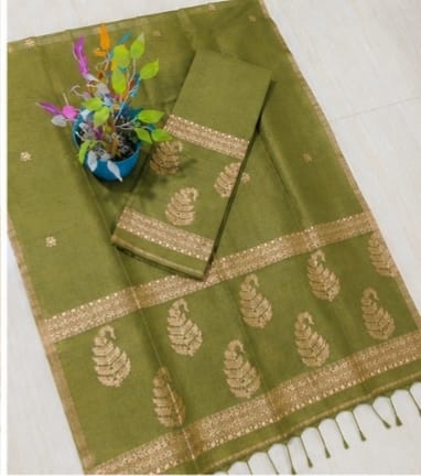 Kairi olive Pure Silk Linen Jamdani suit with handwoven detailing and net tassel dupatta by Rihyaaz