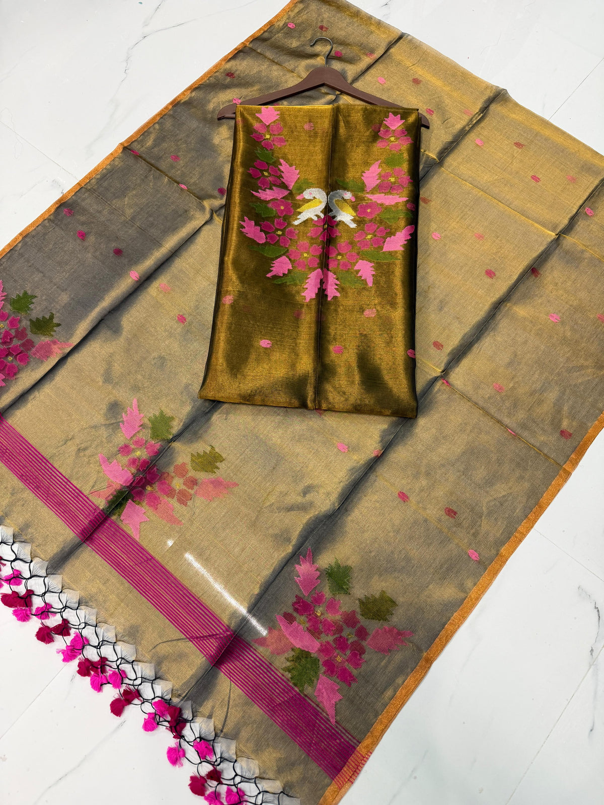 Kaveri Olive Tissue Kora Needle Jamdani suit by Rihyaaz featuring delicate Jamdani weaving and elegant traditional detailing.