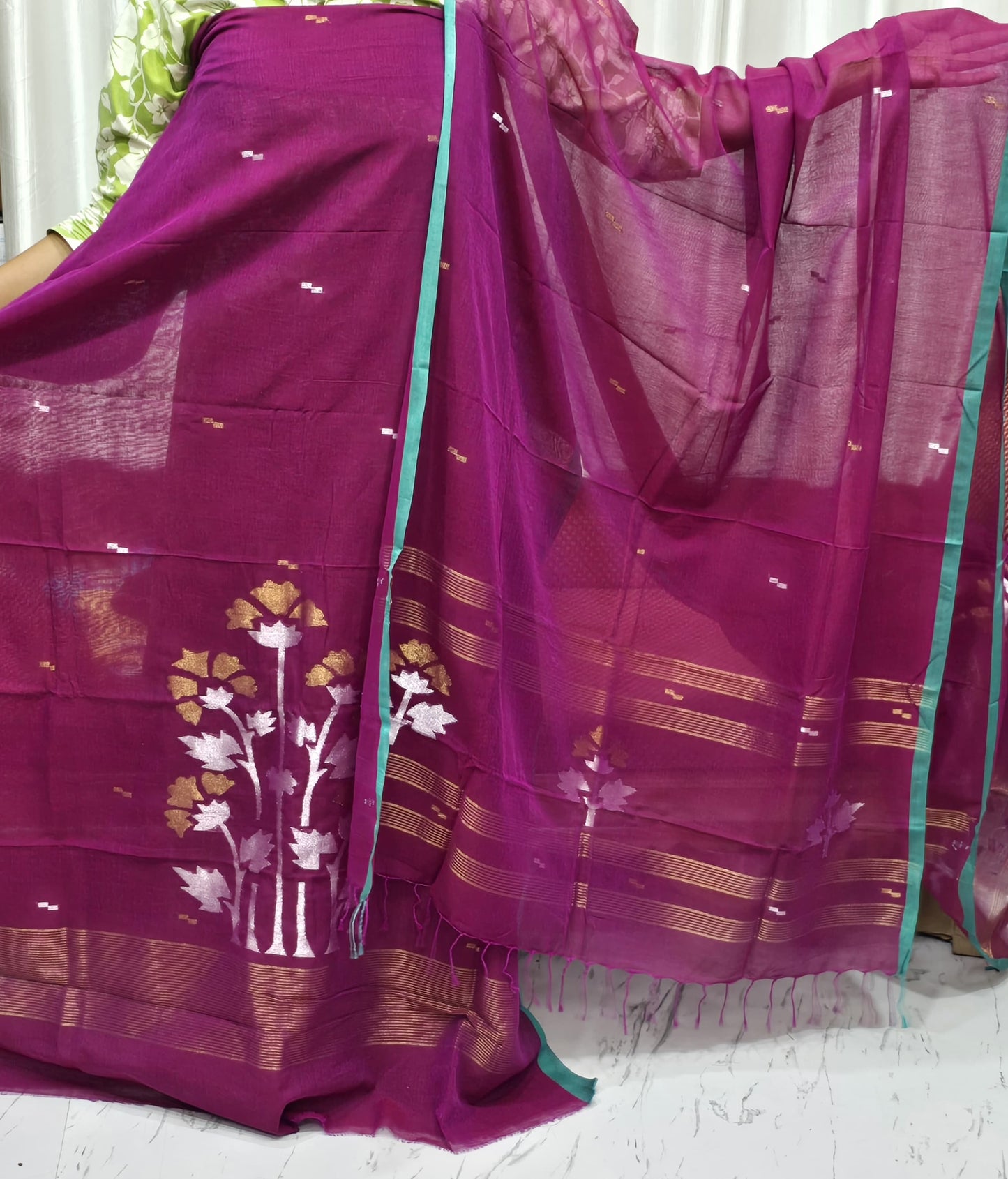 Tora – Mul Cotton Dual Zari Woven Jamdani Suit with handwoven elegant dual zari floral motif detailing on soft, lightweight cotton fabric. A handwoven elegance by Rihyaaz.