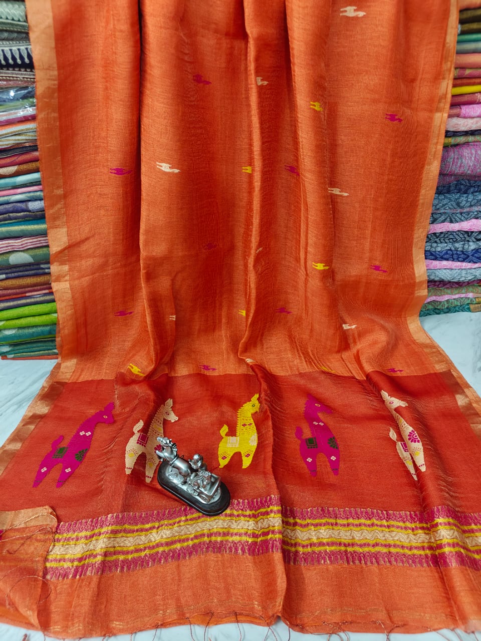 Terracotta Linen Silk Saree with intricate Resham woven palla by Rihyaaz, premium handwoven ethnic saree featuring elegant craftsmanship, soft drape, and timeless festive wear for women