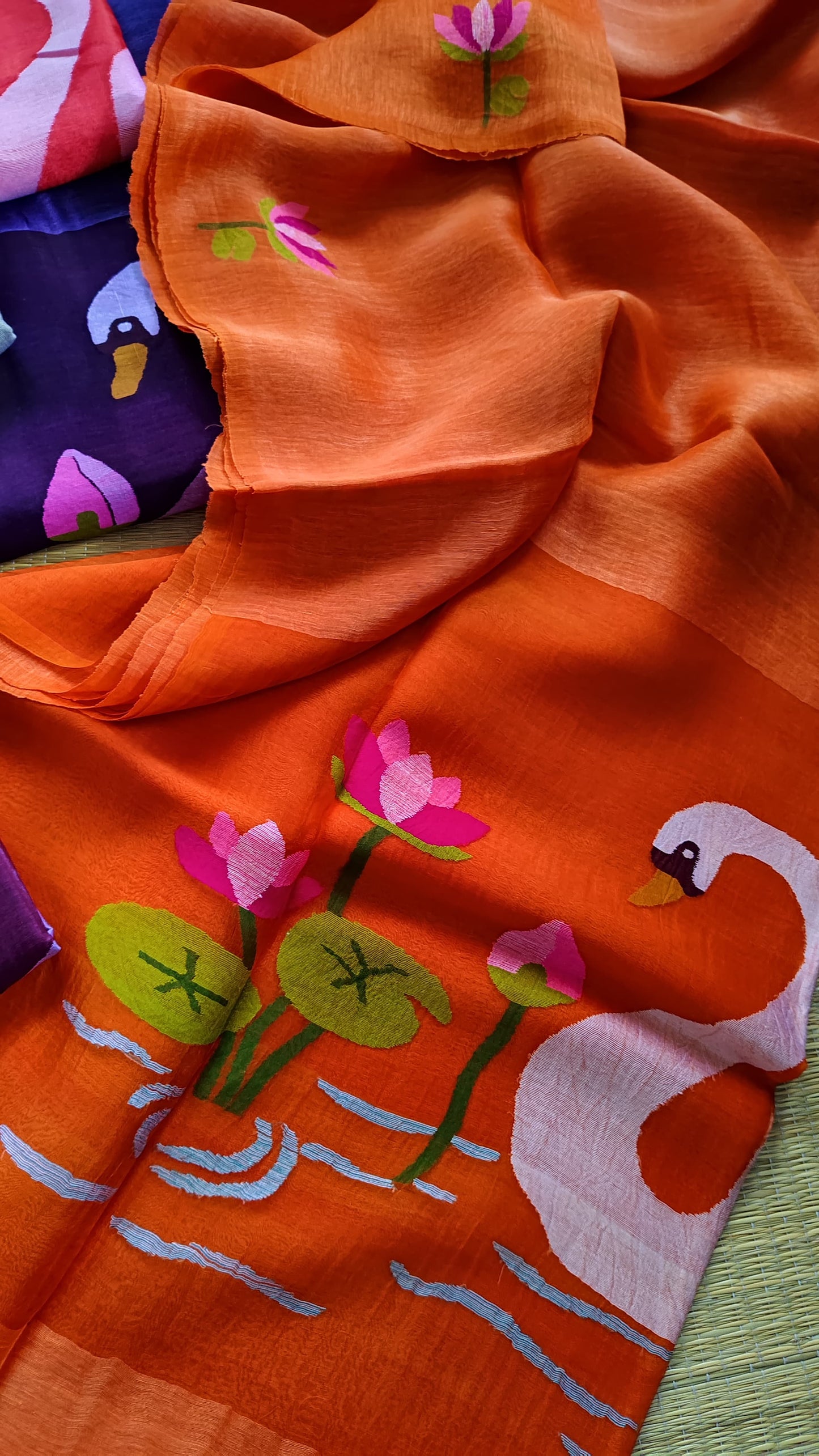 Pure Jayashree linen silk saree with handwoven needlework resham palla with delicate lotus and swan motifs and running blouse piece by Rihyaaz.