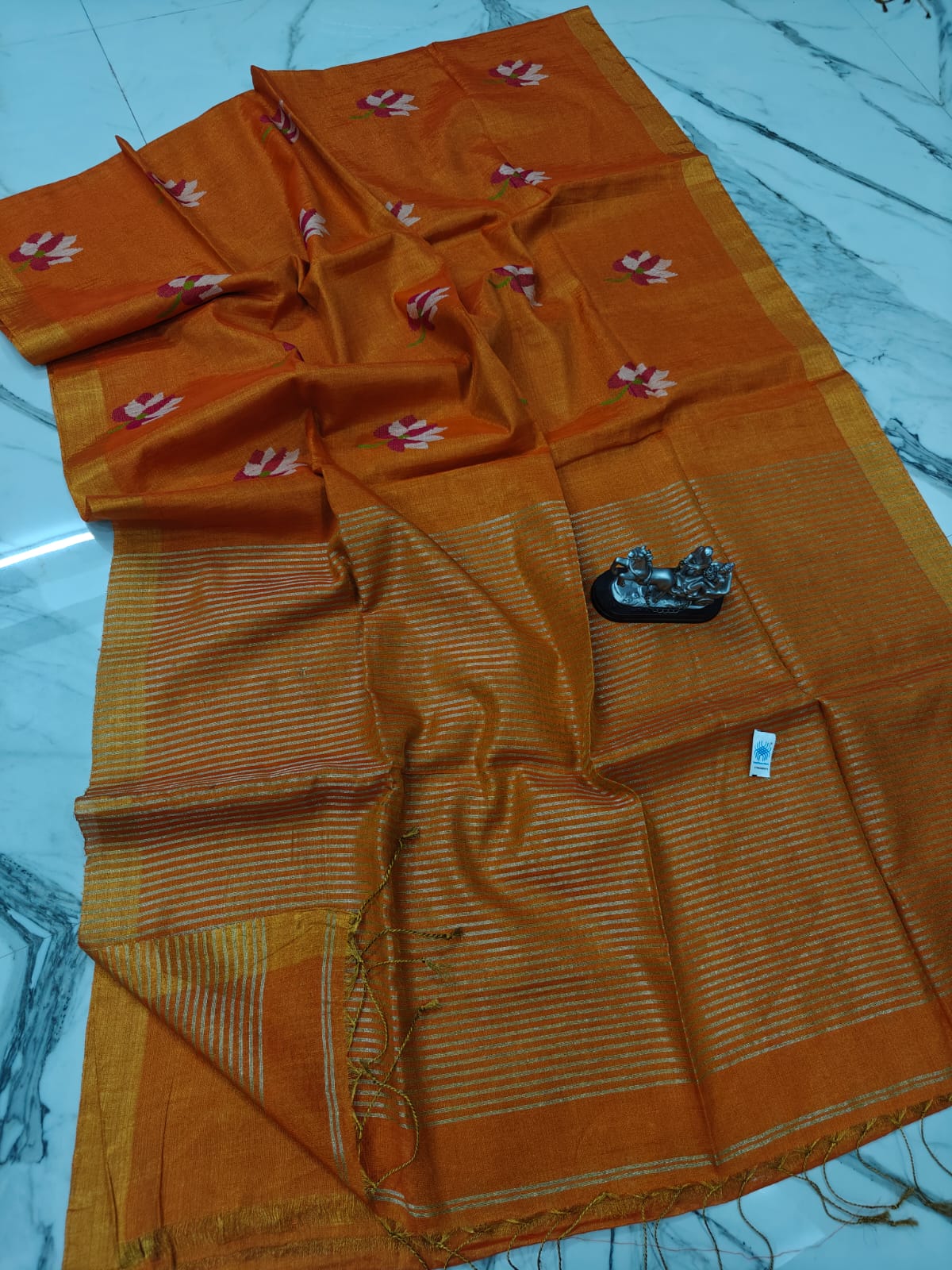 Lolita tissue linen allover weaved floral motiffs needle Jamdani saree with blouse piece, and striped zari weave in Pallu, handcrafted Bengali saree by Rihyaaz
