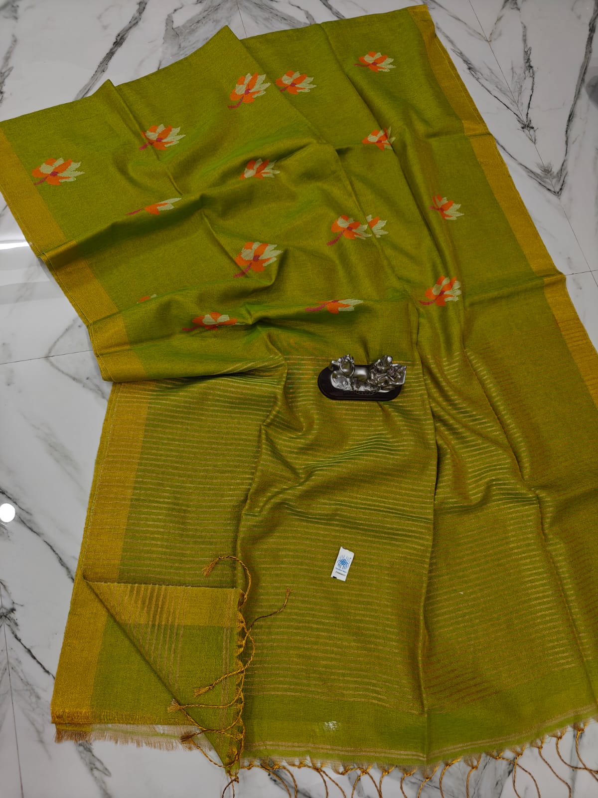 Lolita tissue linen allover weaved floral motiffs needle Jamdani saree with blouse piece, and striped zari weave in Pallu, handcrafted Bengali saree by Rihyaaz