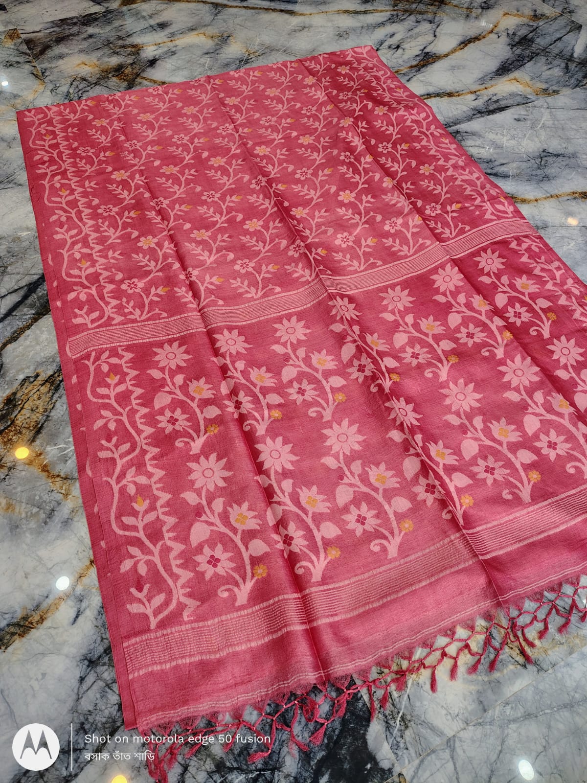 Silkmark certified Peach Bengal handloom Tussar tie and dye Allover Floral motif saree with an all-over tie-dye pattern, elegant contrast border, and blouse piece Exclusively by Rihyaaz.