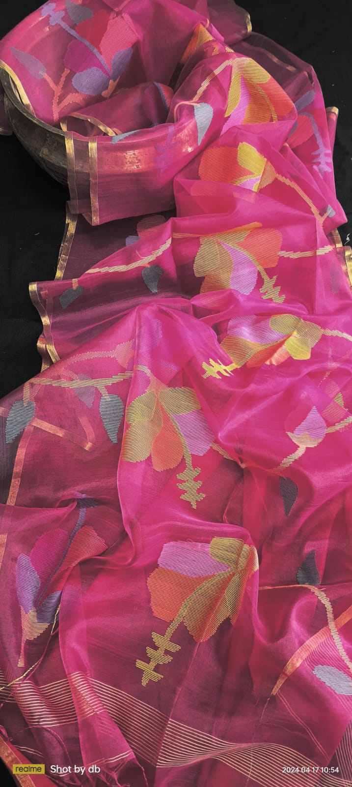 Blossom muslin Jamdani saree with allover floral handwoven motifs by Rihyaaz