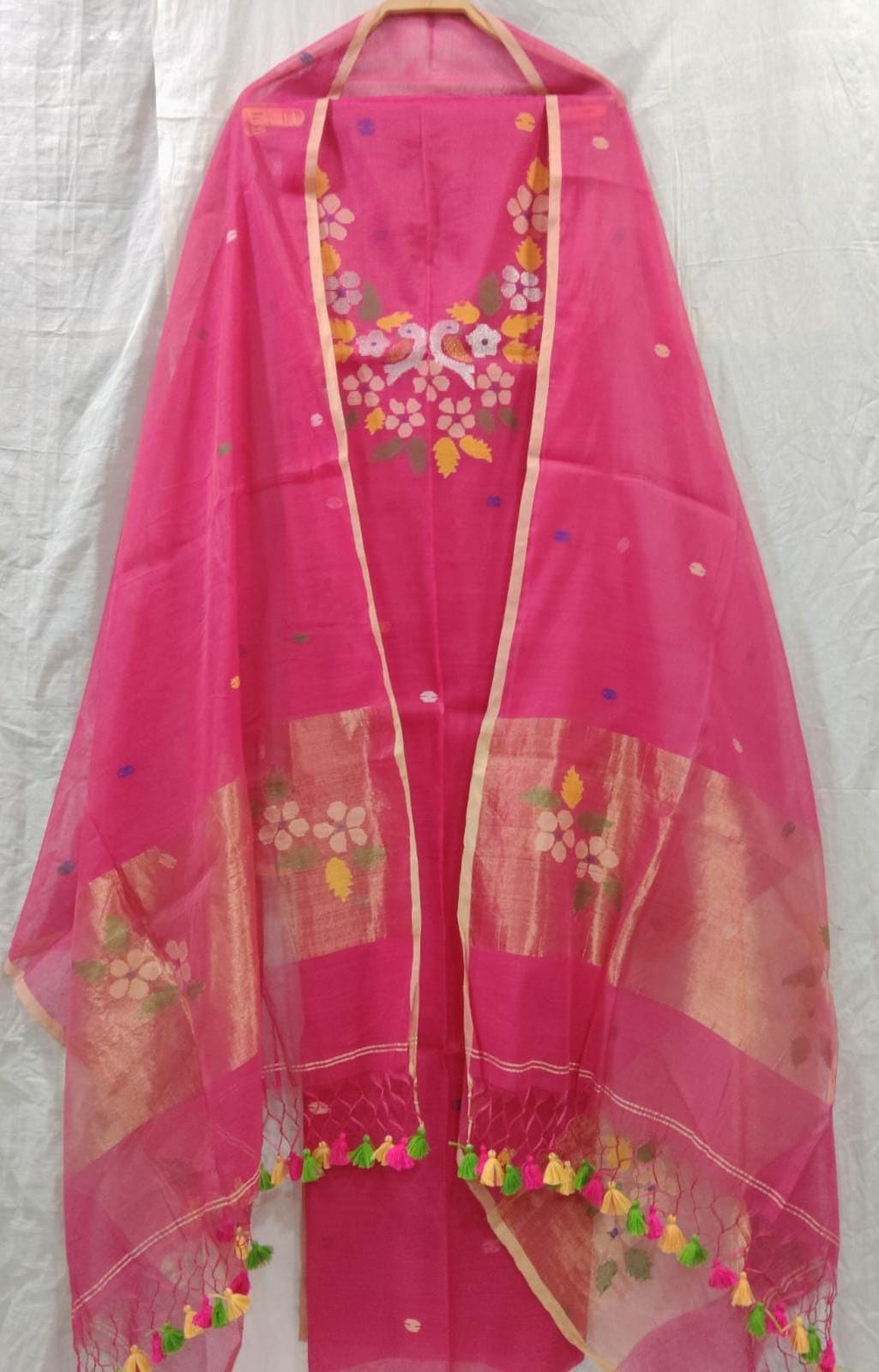 Rihyaaz Muslin Jamdani suit with matching tassel dupatta and delicate needle-weaved floral motifs.