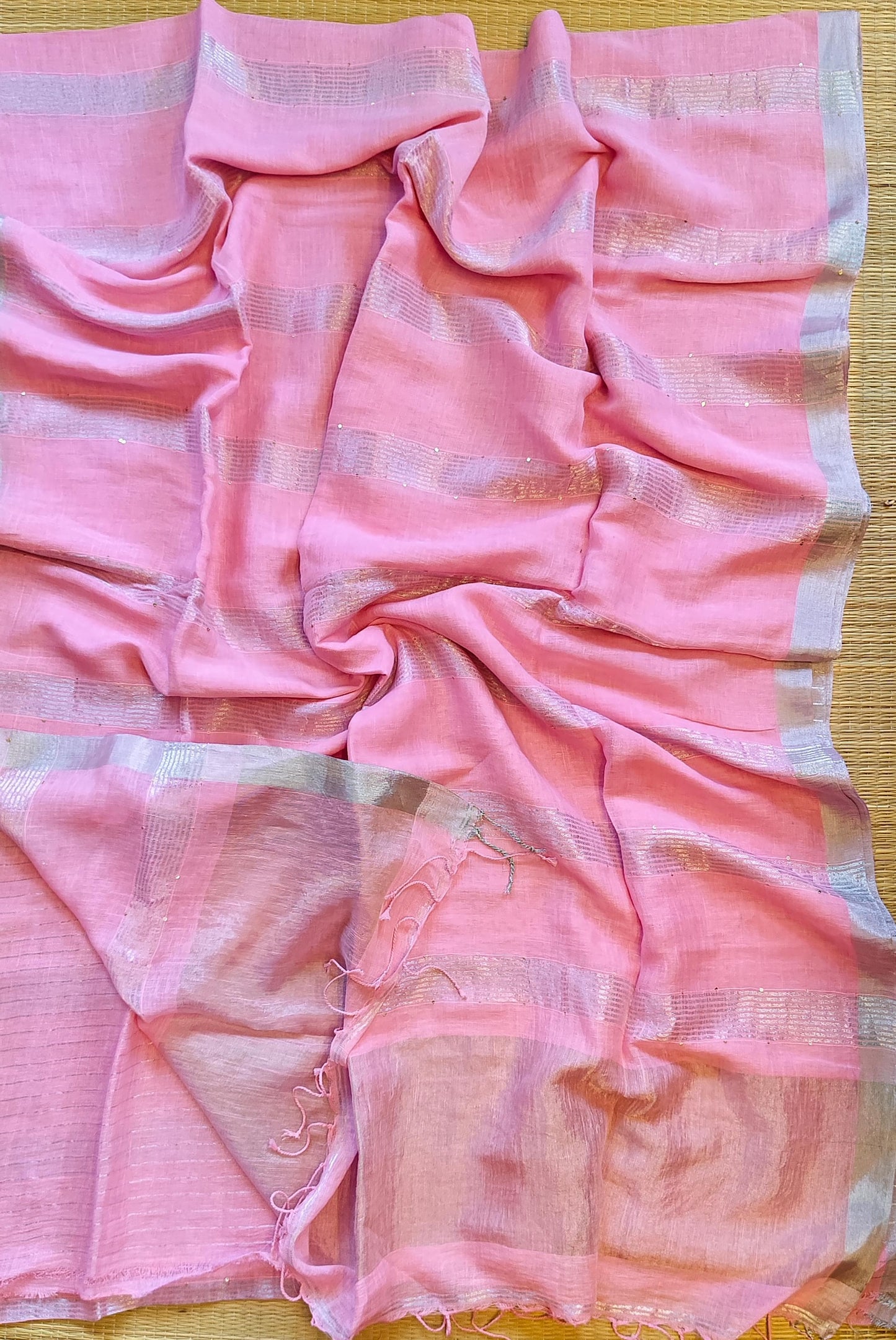 Pehal Premium Jayashree linen saree with tested zari pallu, sleek silver border, all-over sequin-line detailing and zari-striped blouse piece by Rihyaaz.