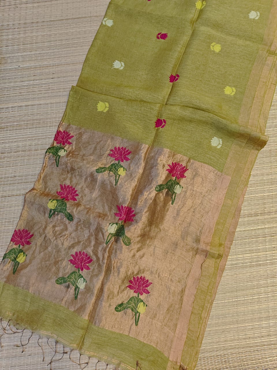 Traditional fabric with floral patterns on a textured surface