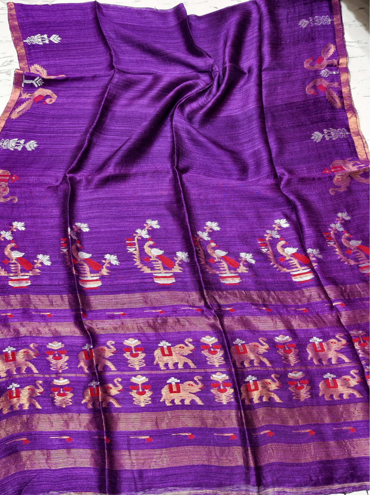 Swarnim Purple pure zari Meenakari Matka saree by Rihyaaz Fashions featuring traditional Meenakari detailing and elegant zari work, perfect for festive wear, weddings and special occasions.
