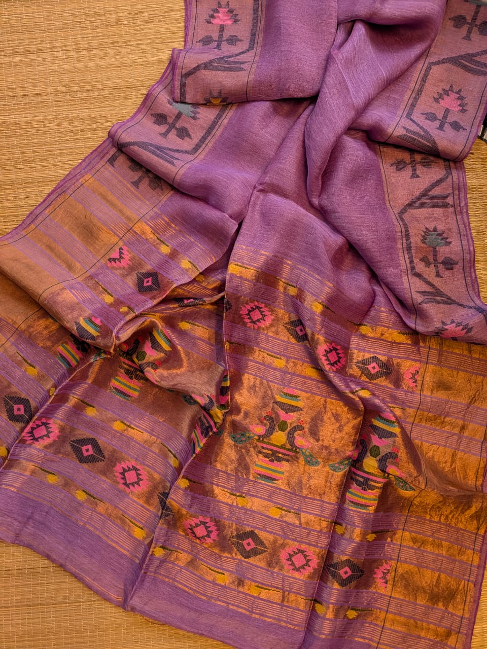Iravati Purple exclusive silk linen saree featuring a tested zari Jamdani border, elegant Paithani-style tissue pallu, and matching running blouse piece by Rihyaaz Fashions.