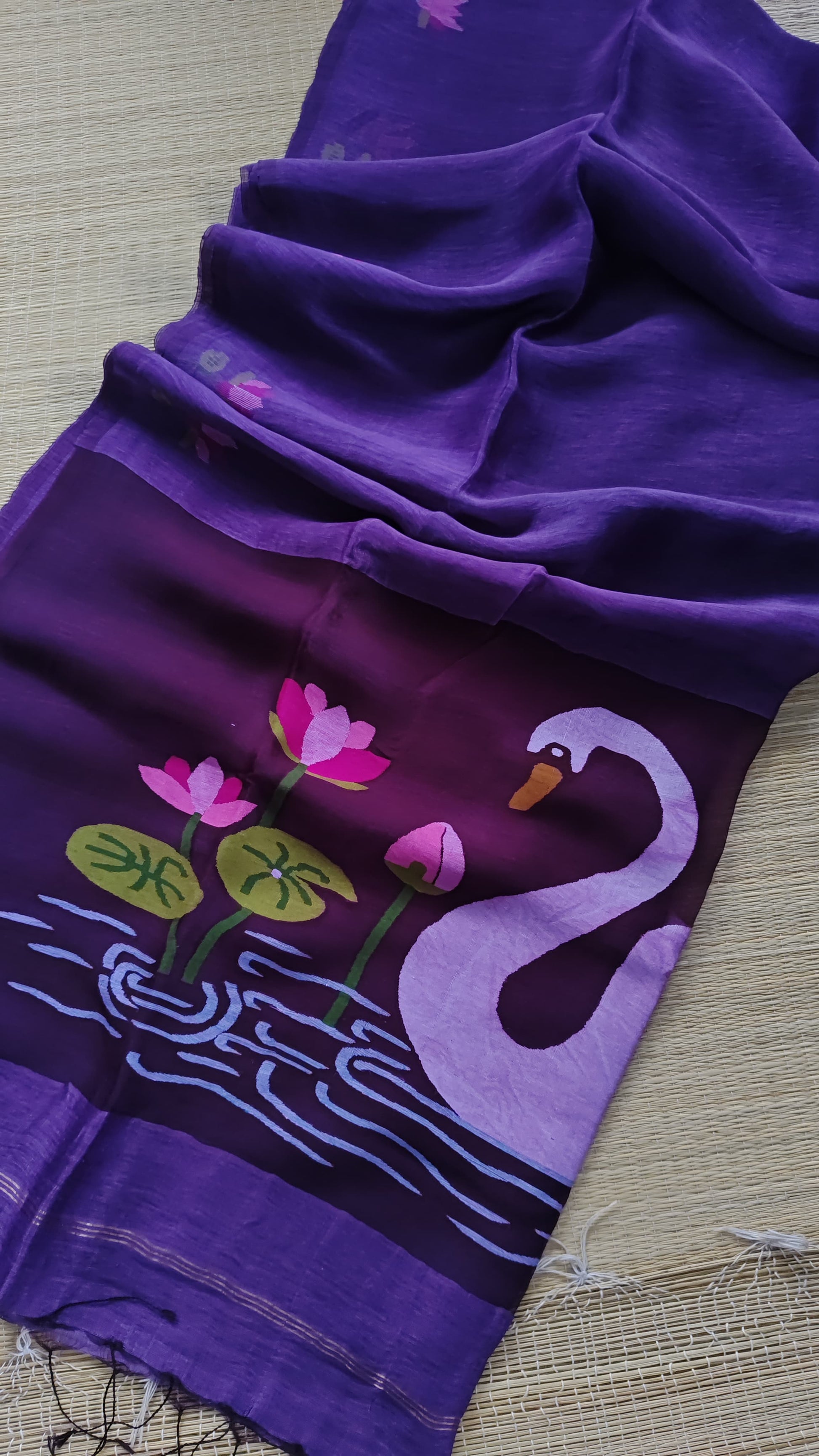 Pure Jayashree linen silk saree with handwoven needlework resham palla with delicate lotus and swan motifs and running blouse piece by Rihyaaz.