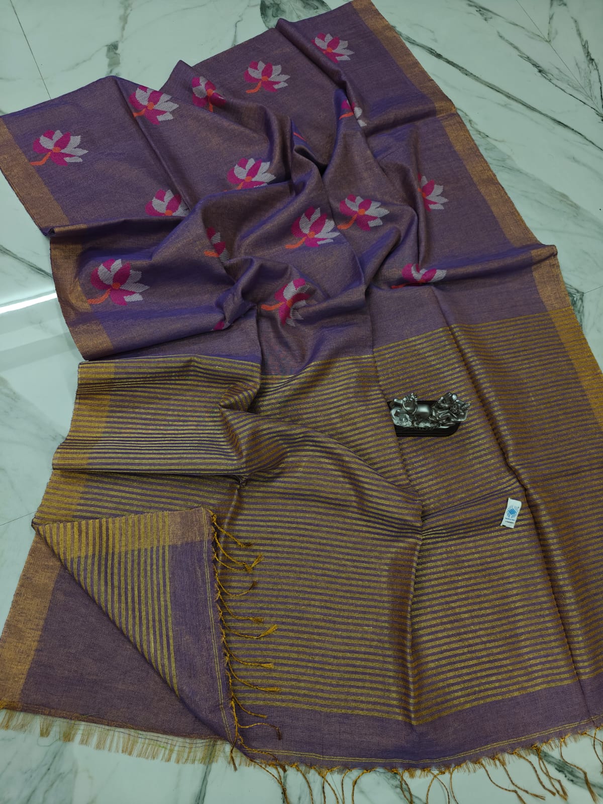 Lolita tissue linen allover weaved floral motiffs needle Jamdani saree with blouse piece, and striped zari weave in Pallu, handcrafted Bengali saree by Rihyaaz