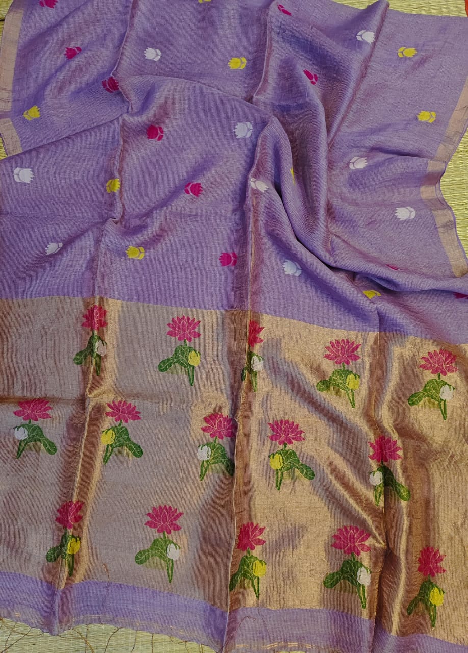 Purple saree with floral patterns on a beige background