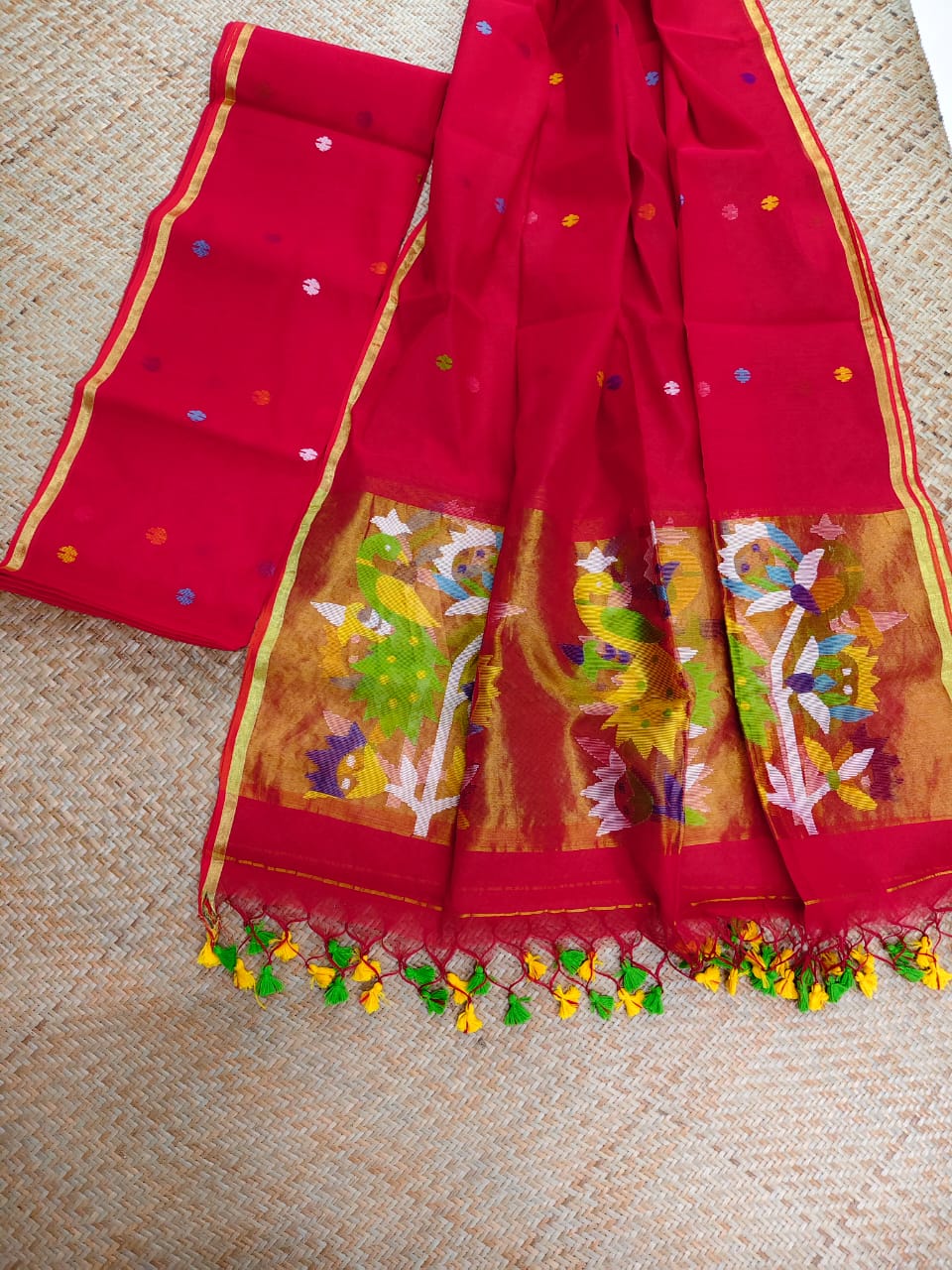 Morni red premium muslin tissue suit with intricate needle work Jamdani palla Peacock Motif dupatta by Rihyaaz.