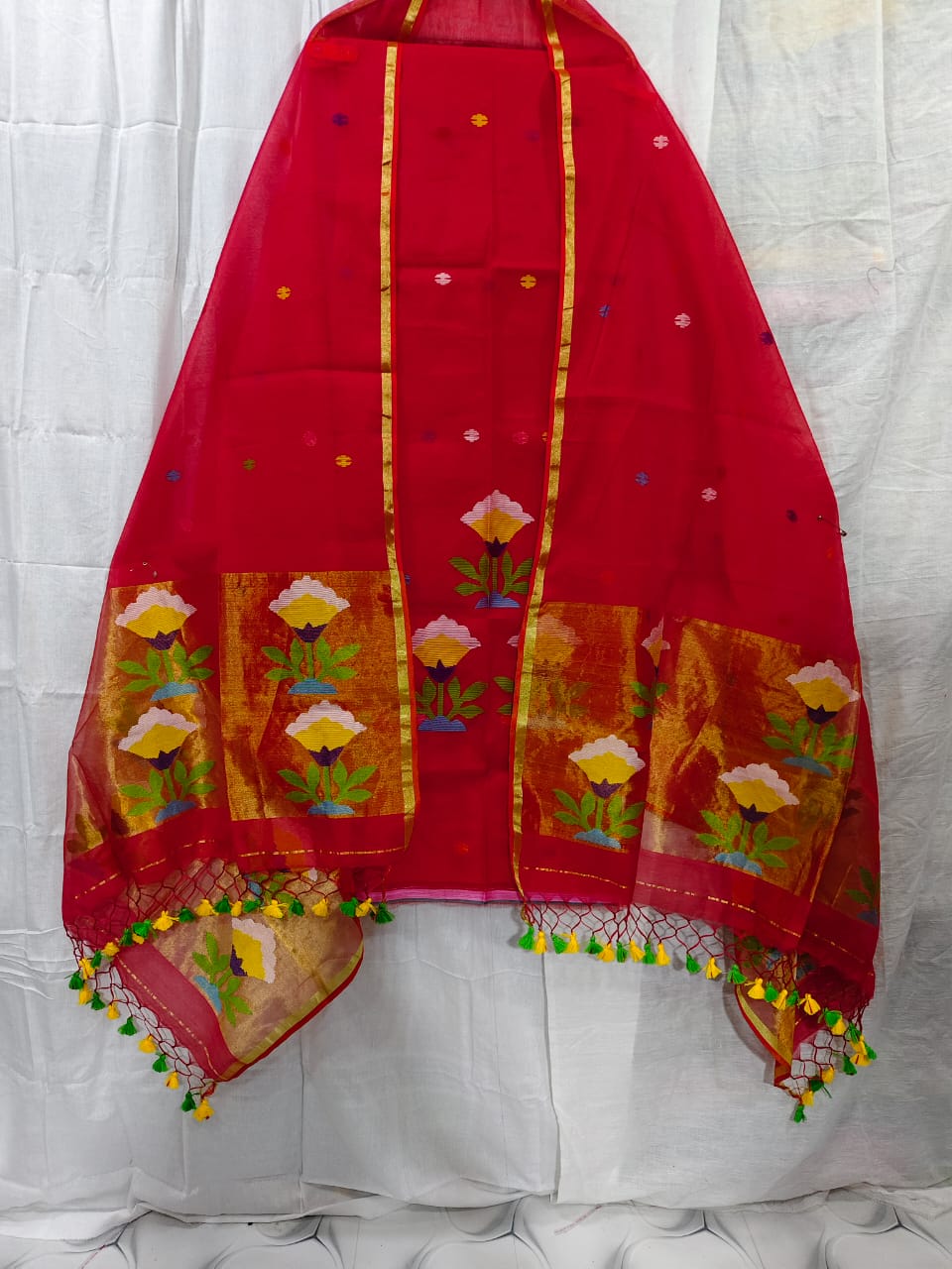 Rihyaaz muslin suit with 2.5 meter top and tasselled 2.5 meter dupatta, elegant ethnic Indian wear.
