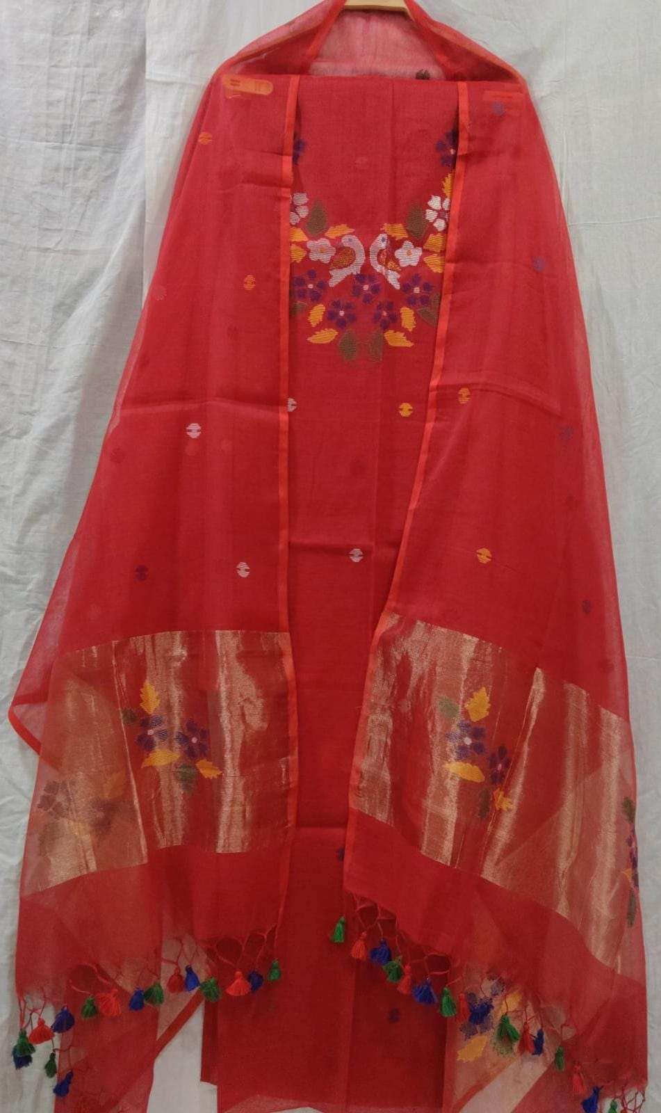 Rihyaaz Muslin Jamdani suit with matching tassel dupatta and delicate needle-weaved floral motifs.
