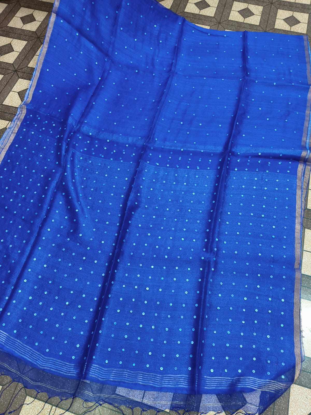Shatranj Pure Matka Muslin Silk saree with zari border and all-over white sequin sea-shell woven palla, paired with running Matka blouse piece by Rihyaaz 