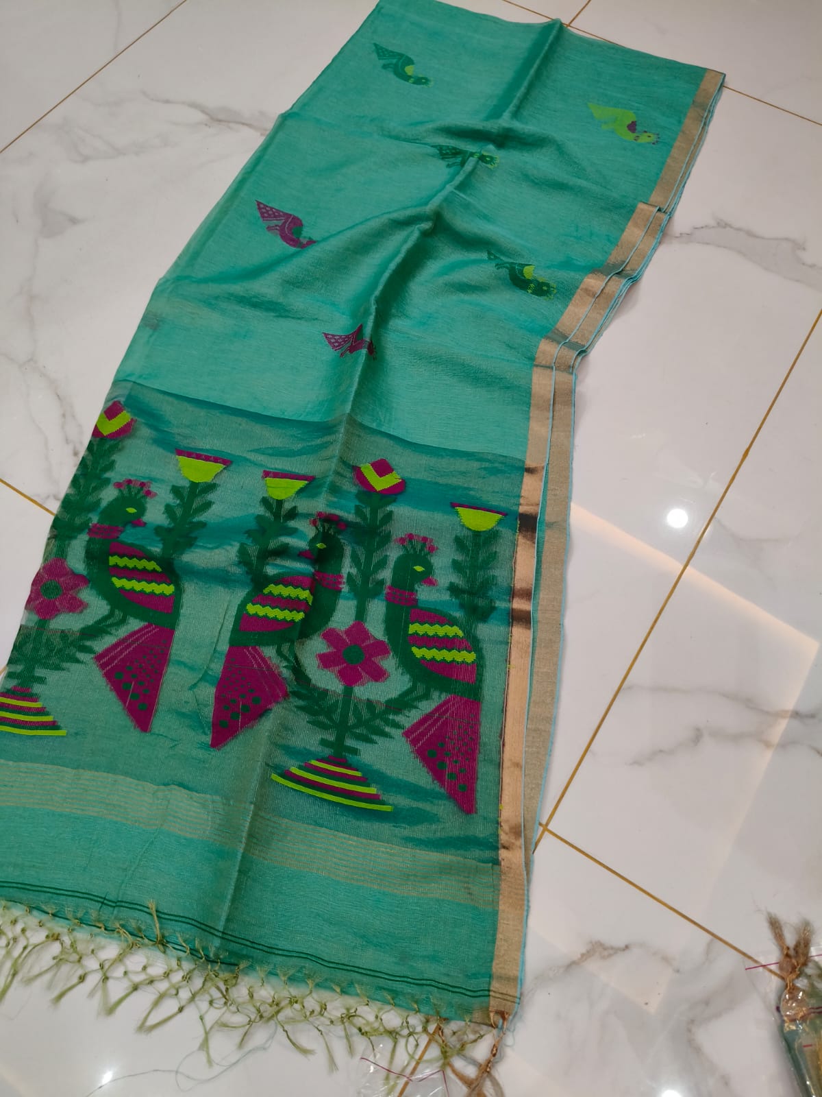 Mayur sea green pure Jayasree linen tissue saree with pure tested zari and Paithani Jamdani work, featuring a running blouse piece by Rihyaaz.