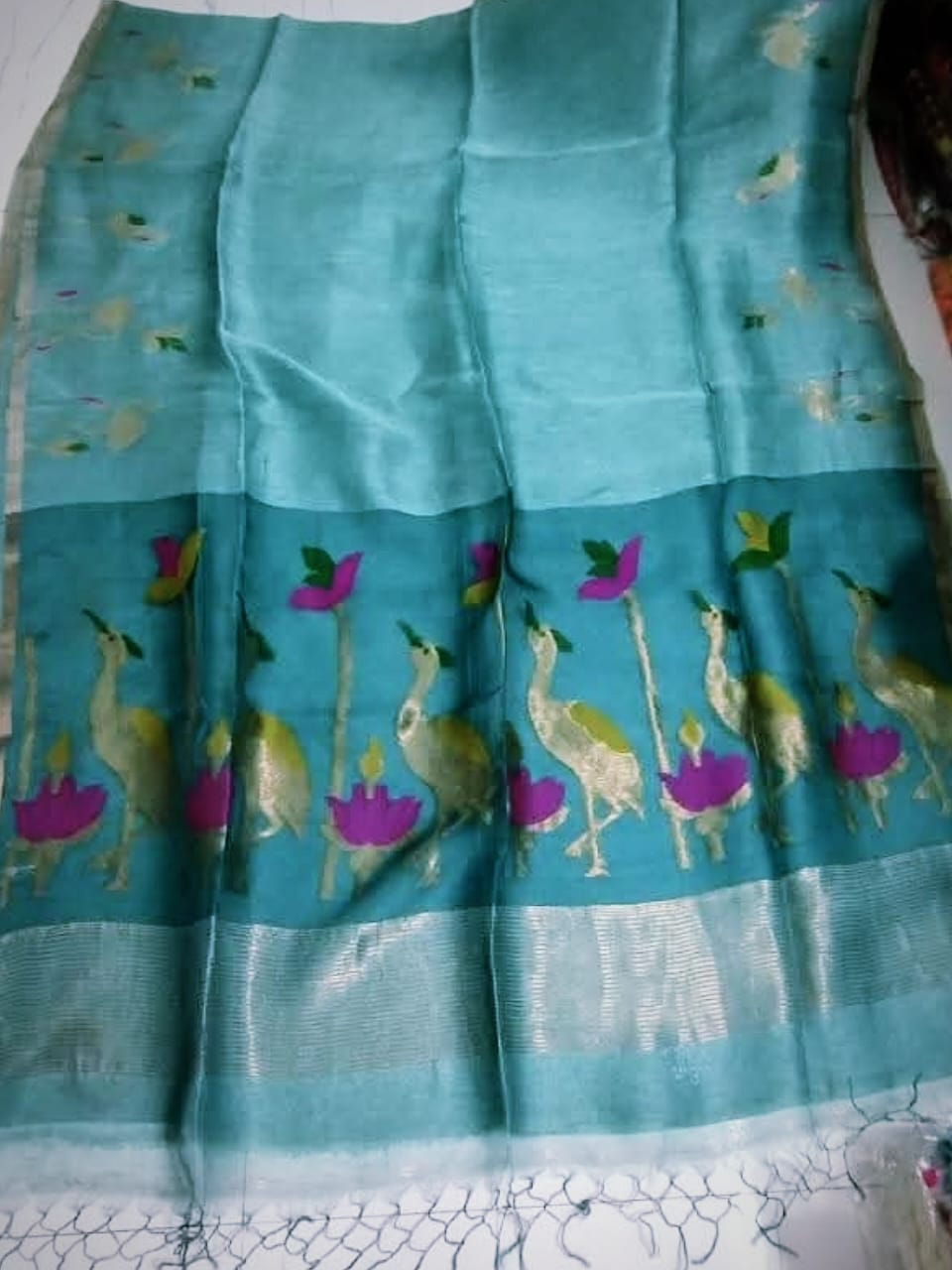 Pelican - Silk Linen Tissue Saree by Rihyaaz featuring premium handwoven silk linen tissue fabric with an elegant sheen, lightweight drape, and luxurious festive design for weddings and celebrations.