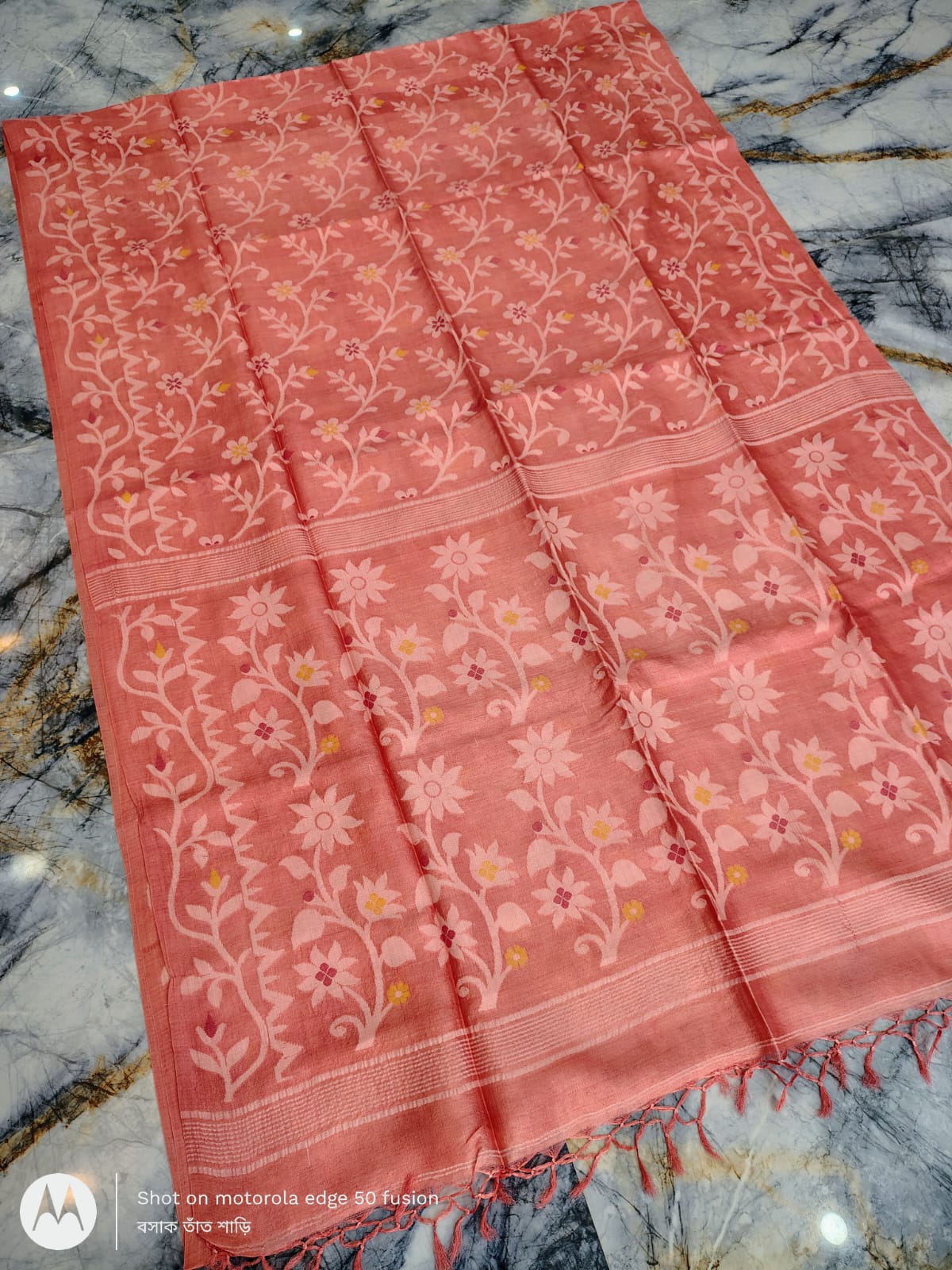 Silkmark certified Soft Peach Bengal handloom Tussar tie and dye Allover Floral motif saree with an all-over tie-dye pattern, elegant contrast border, and blouse piece Exclusively by Rihyaaz.