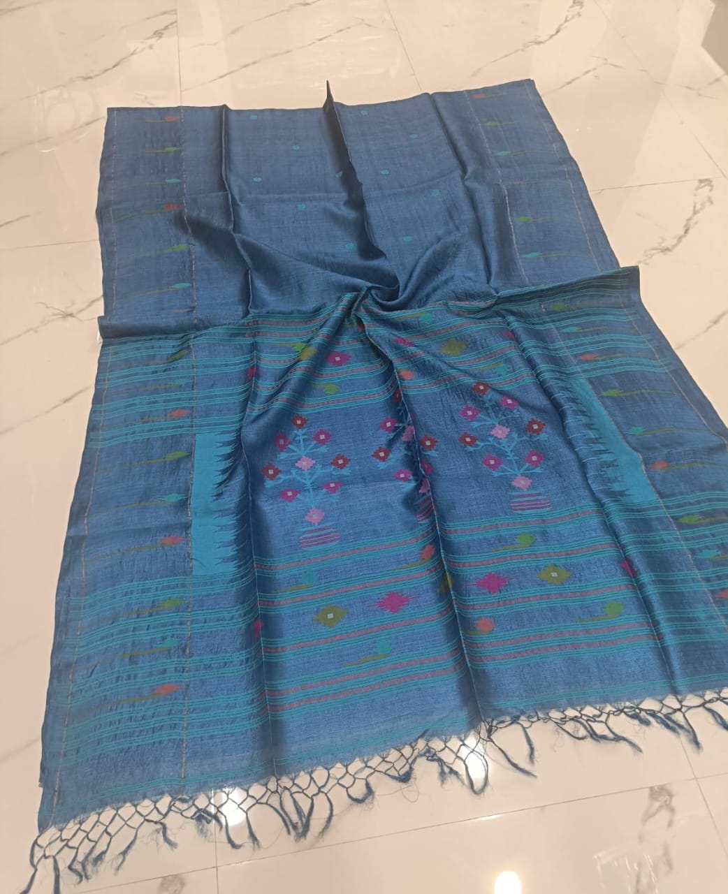 Swarnim Teal Blue Paithani Bengal Tussar saree with intricate Jamdani weaving and running blouse piece by Rihyaaz Fashions.