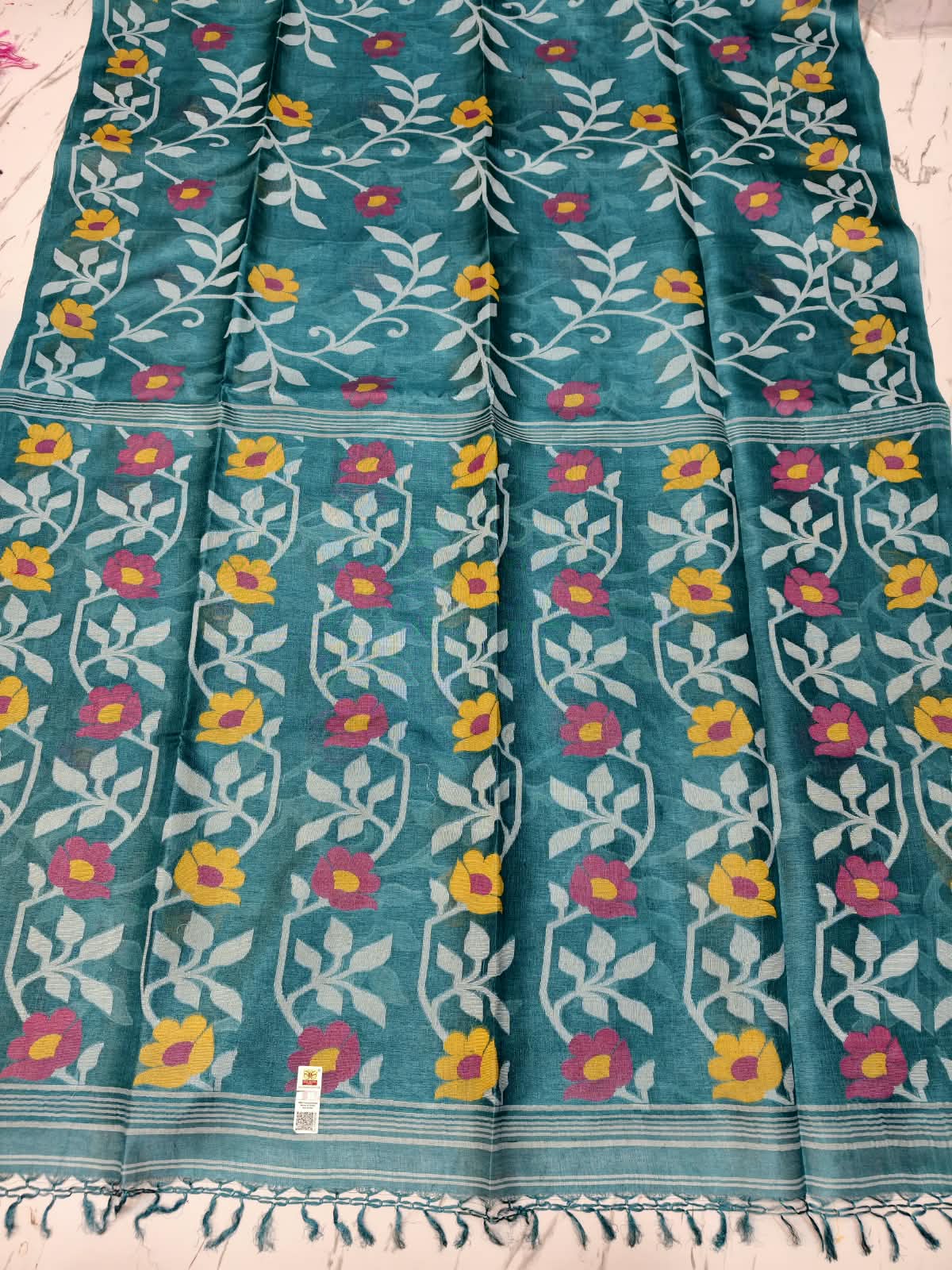 Bageecha Teal Blue Pure Tussar Jamdani saree with intricate all-over handwoven floral Jamdani work, Silk Mark certified by Rihyaaz 