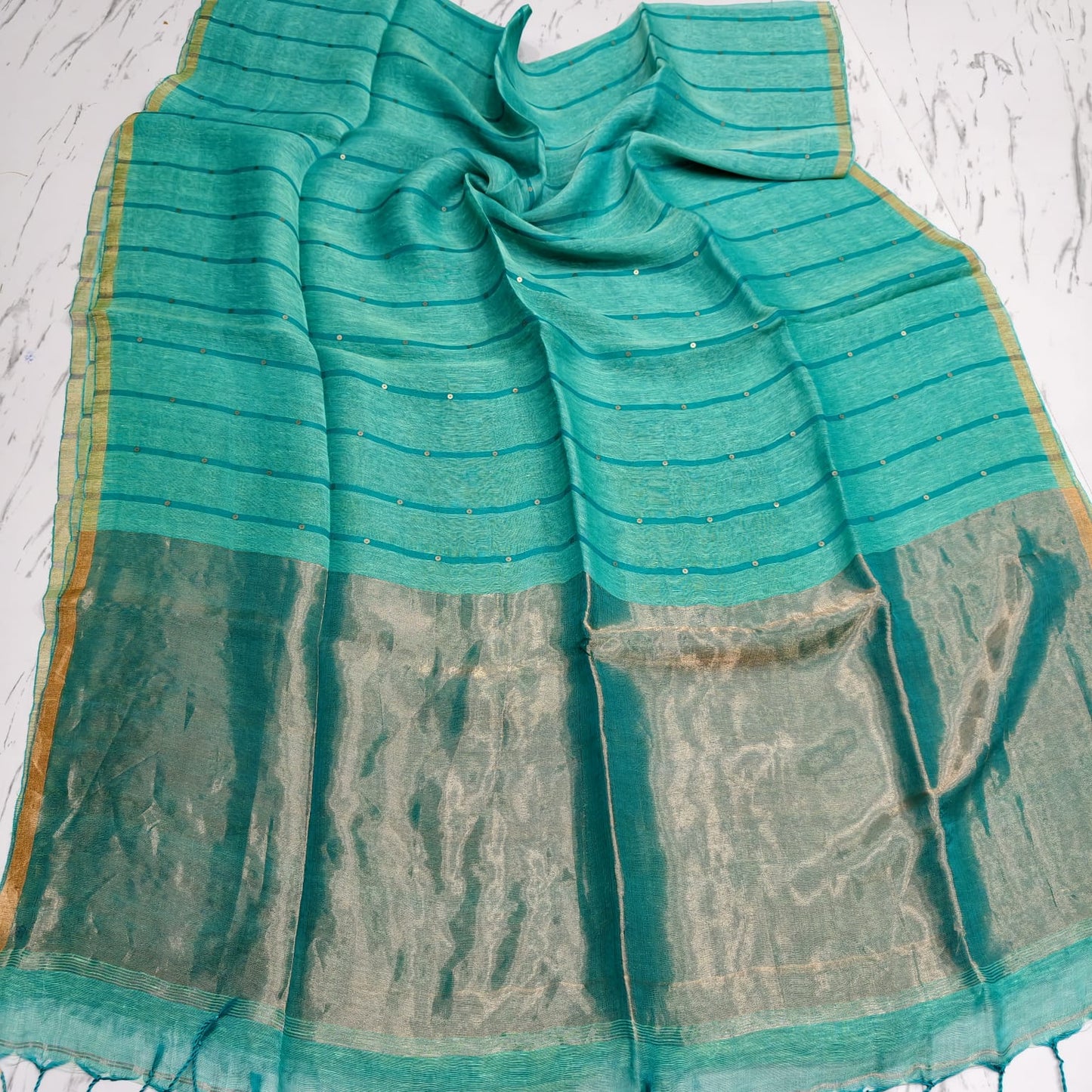 Nakshi Tissue Palla Resham Sequin Weaved Matka Saree by Rihyaaz, featuring elegant traditional weaving and luxurious tissue palla detailing.