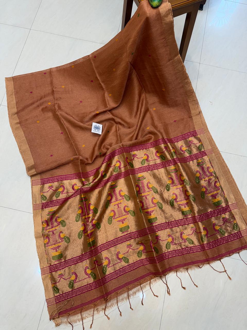 Morni Authentic premium-quality handloom saree crafted in soft pure Tissue Silk Linen with an elegant Paithani-inspired paired with a running blouse piece by Rihyaaz.