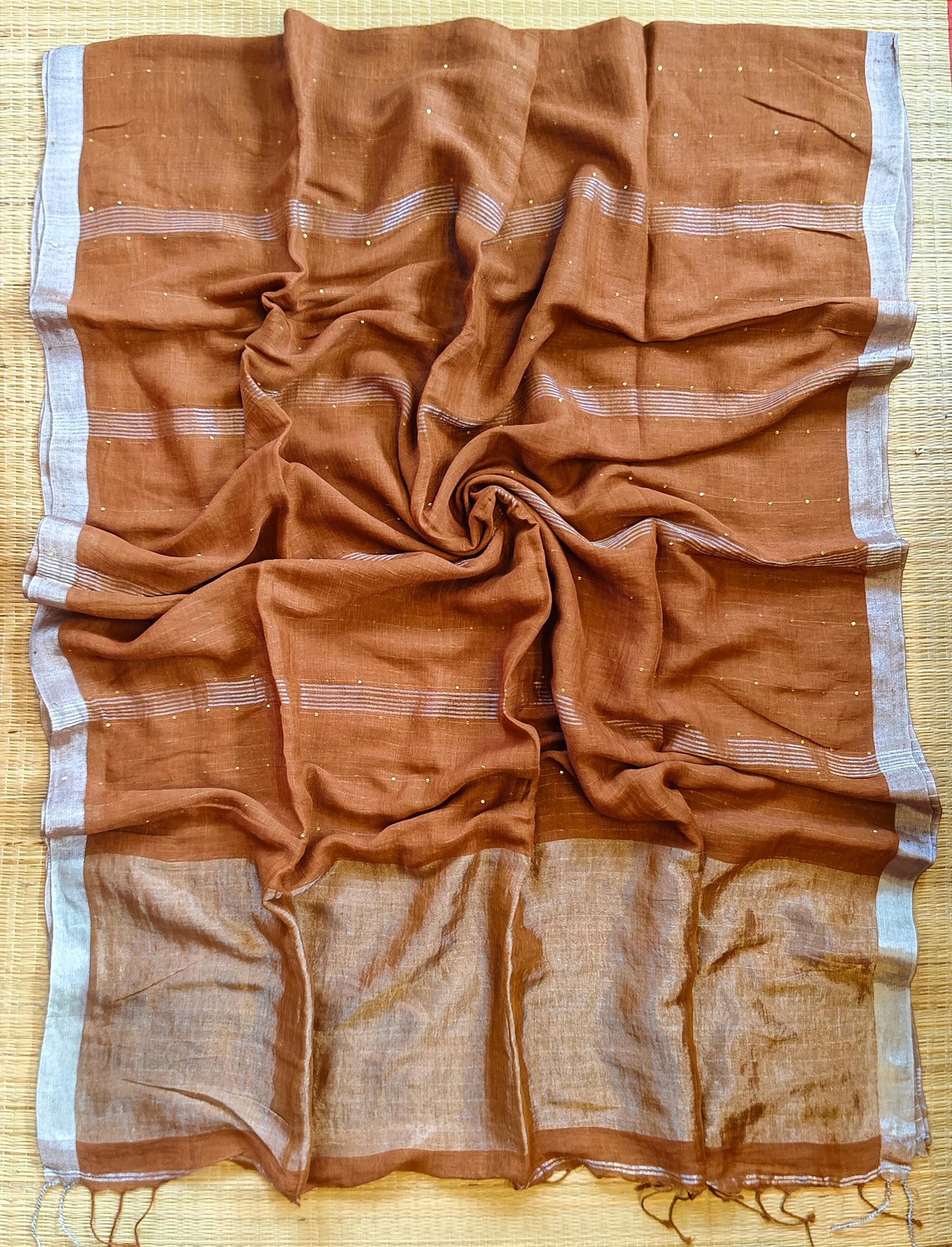 Pehal Premium Jayashree linen saree with tested zari pallu, sleek silver border, all-over sequin-line detailing and zari-striped blouse piece by Rihyaaz.