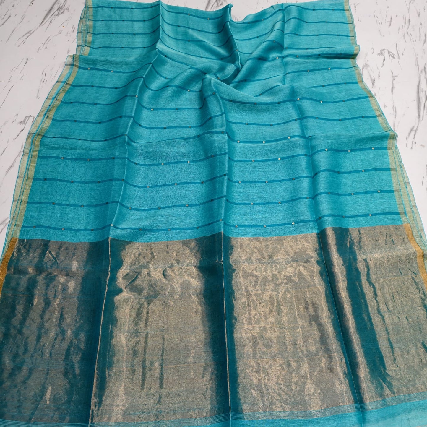 Nakshi Tissue Palla Resham Sequin Weaved Matka Saree by Rihyaaz, featuring elegant traditional weaving and luxurious tissue palla detailing.