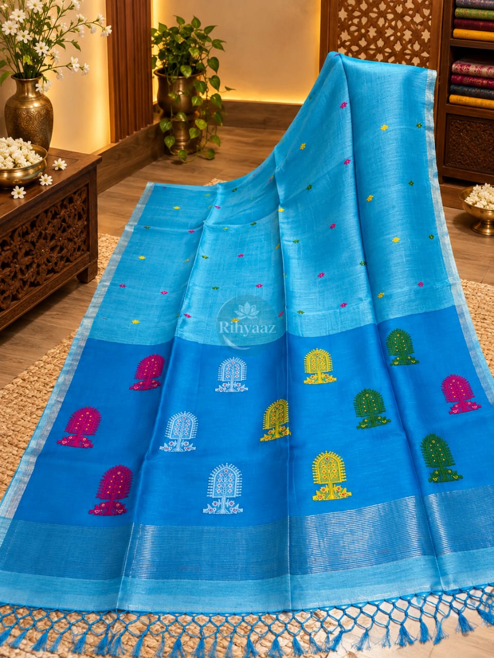 Mukut turquoise linen silk handwoven Jamdani saree by Rihyaaz, featuring elegant handwoven Jamdani craftsmanship on premium silk-linen fabric.
