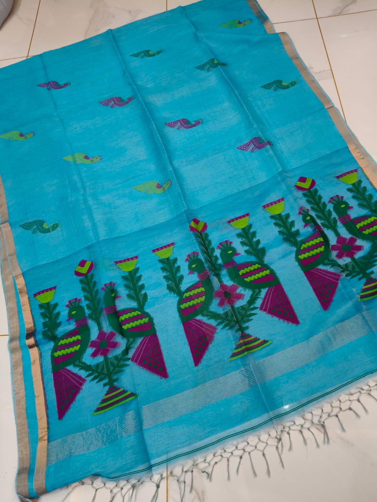 Mayur turquoise pure Jayasree linen tissue saree with pure tested zari and Paithani Jamdani work, featuring a running blouse piece by Rihyaaz.