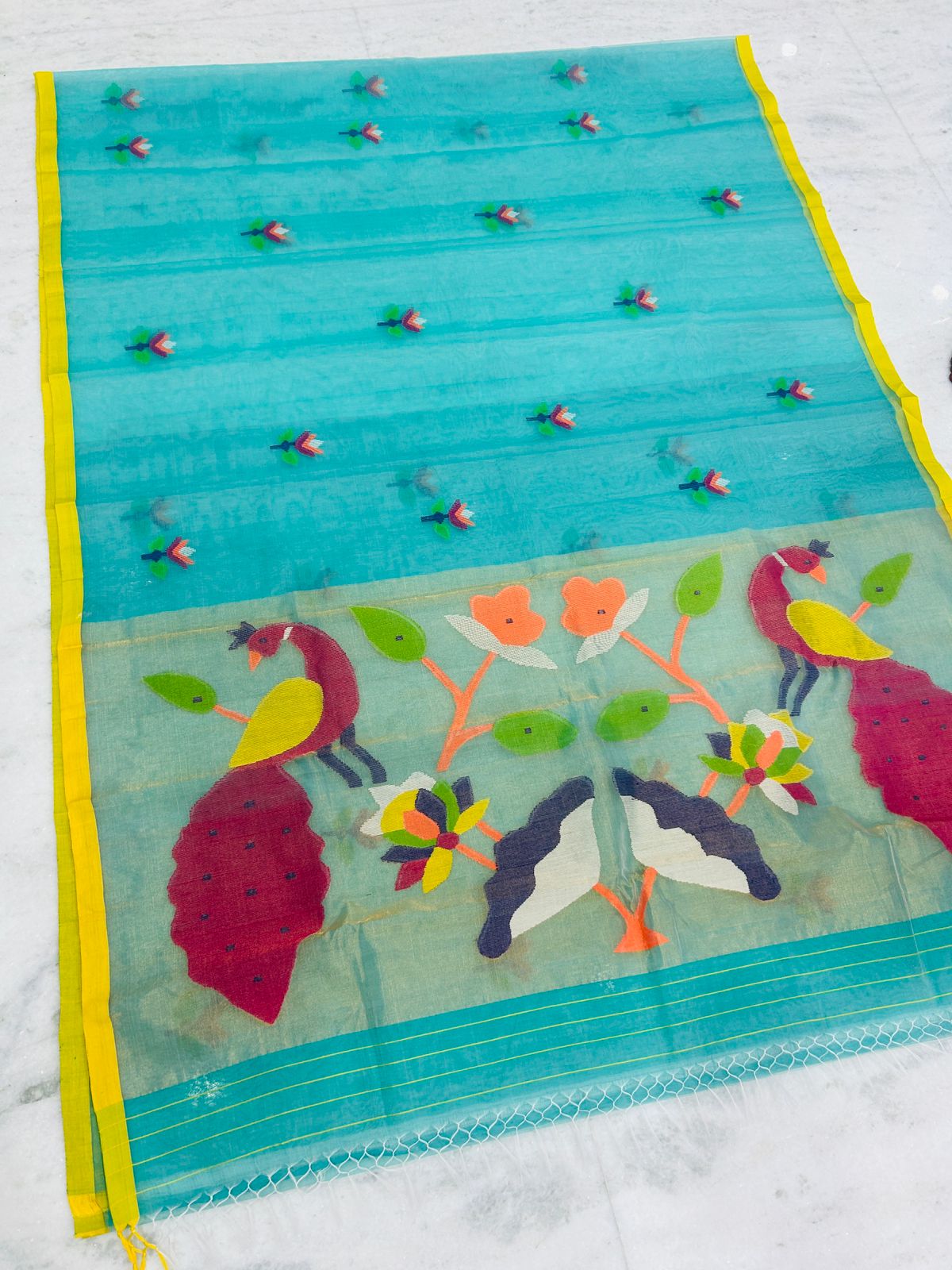 Shahi pure muslin handwoven saree with blouse piece by Rihyaaz, showcasing traditional Indian handloom craftsmanship and elegant woven texture.
