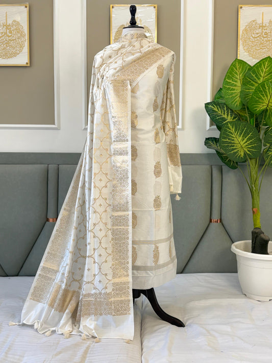Exclusive White Banarasi Chiniya Silk Unstitched Salwar Kameez Design No. 8 by Rihyaaz, featuring a semi Chiniya silk top with intricate zari weaving, matching semi Chiniya silk zari-woven dupatta, and plain dyed cotton silk bottom, 2.5 metres each, premium festive ethnic wear.