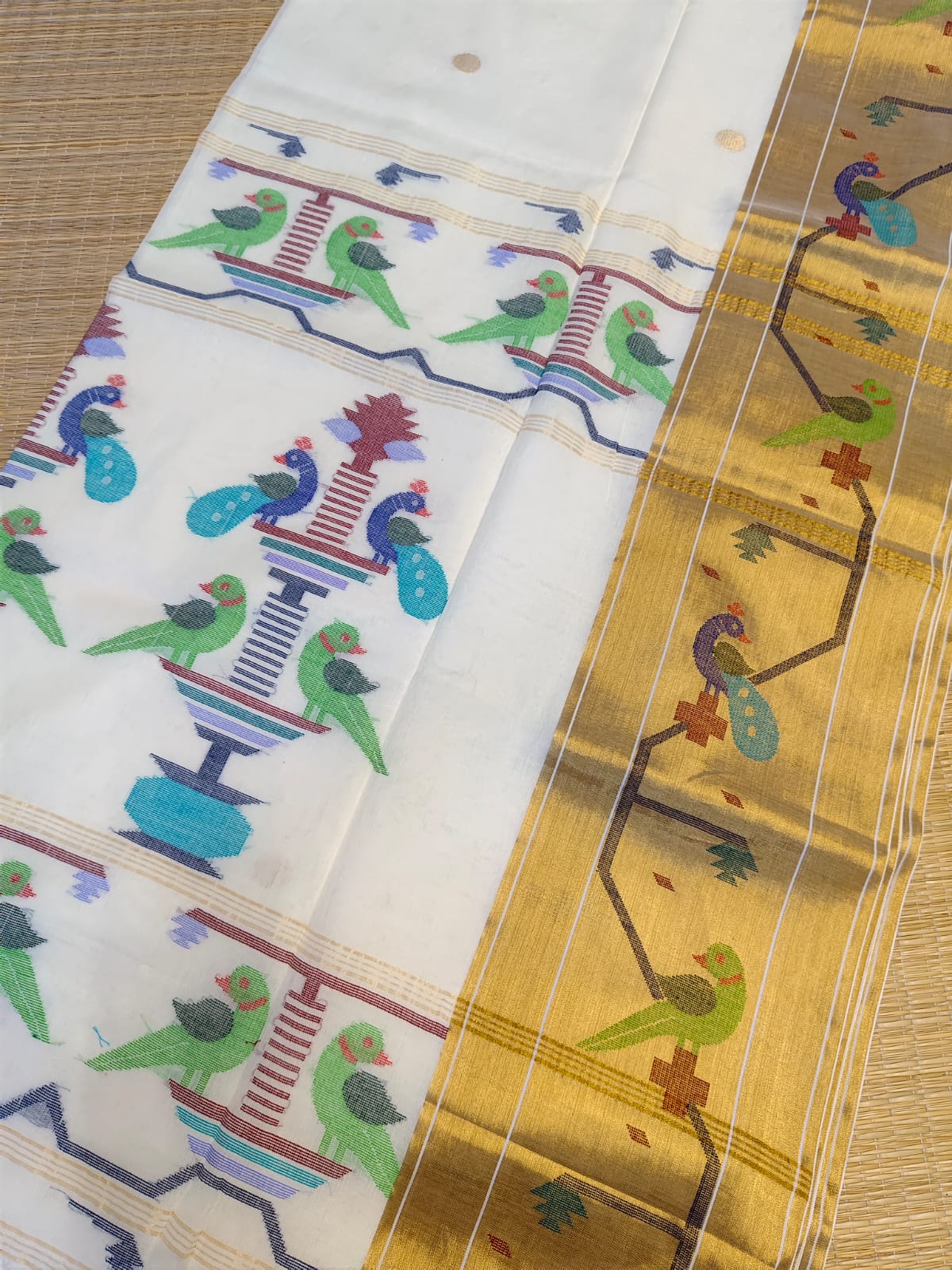 Two fabric swatches with intricate patterns on a wooden surface
