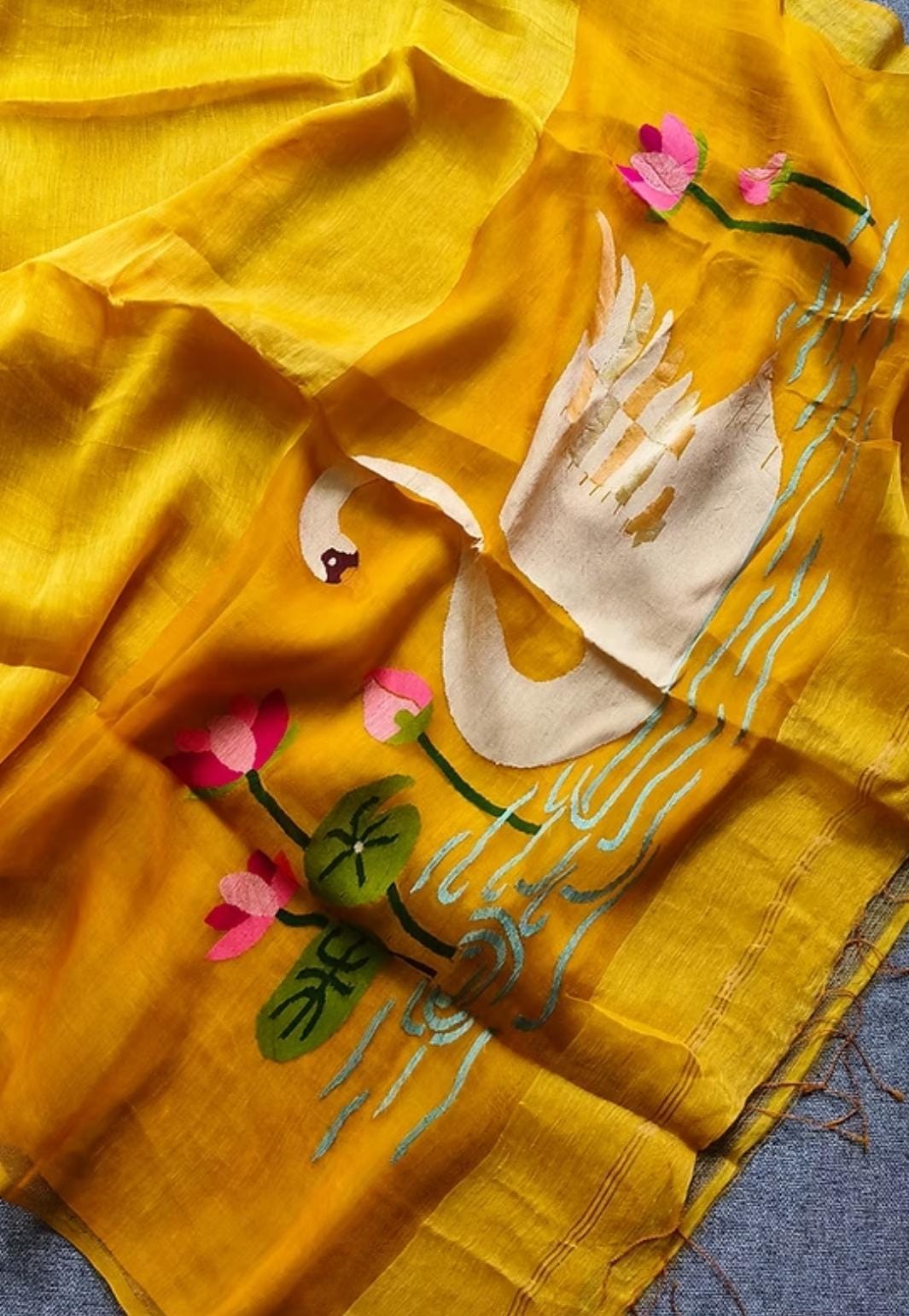 Pure Jayashree linen silk saree with handwoven needlework resham palla with delicate lotus and swan motifs and running blouse piece by Rihyaaz.