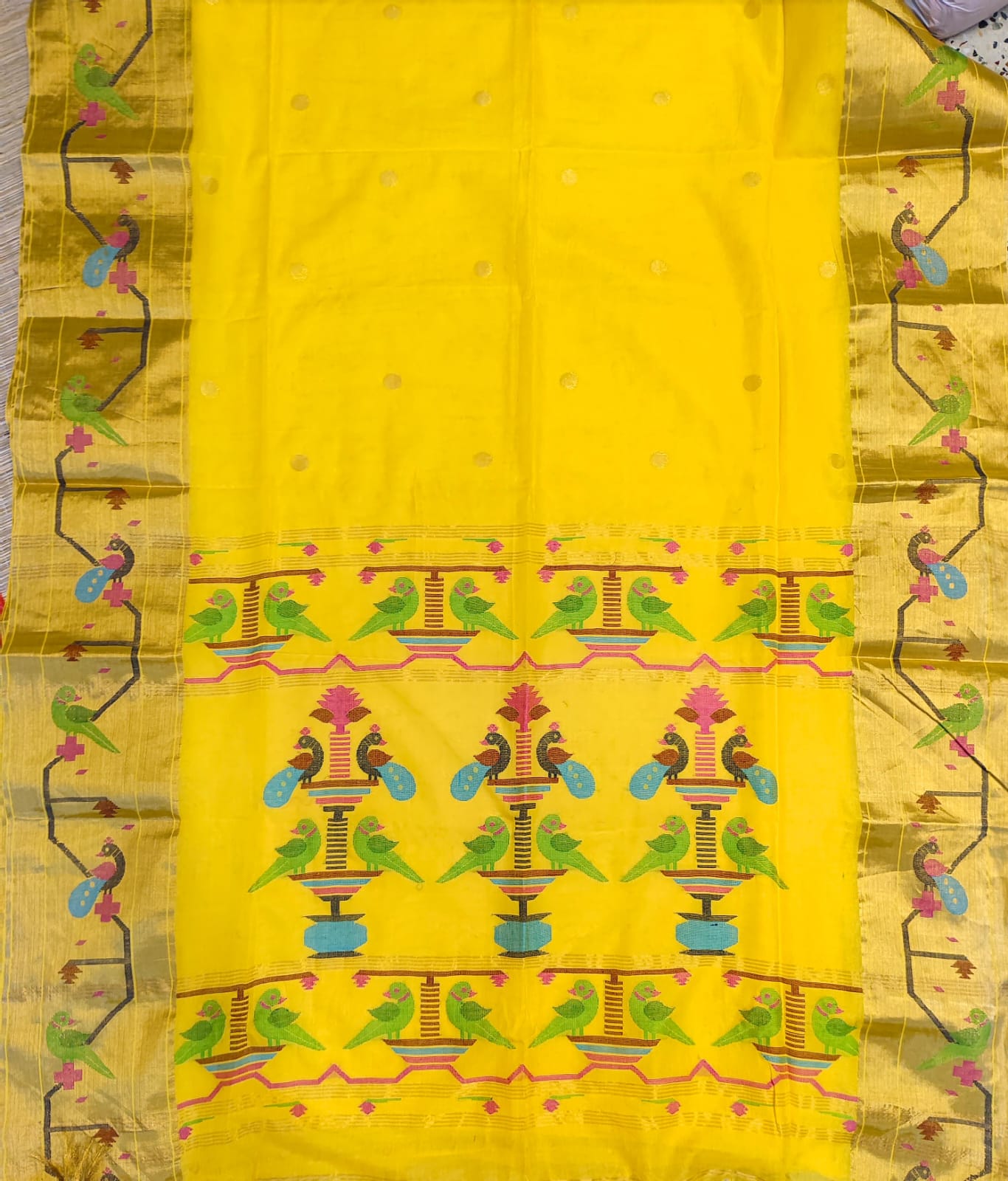 Yellow fabric with colorful bird pattern