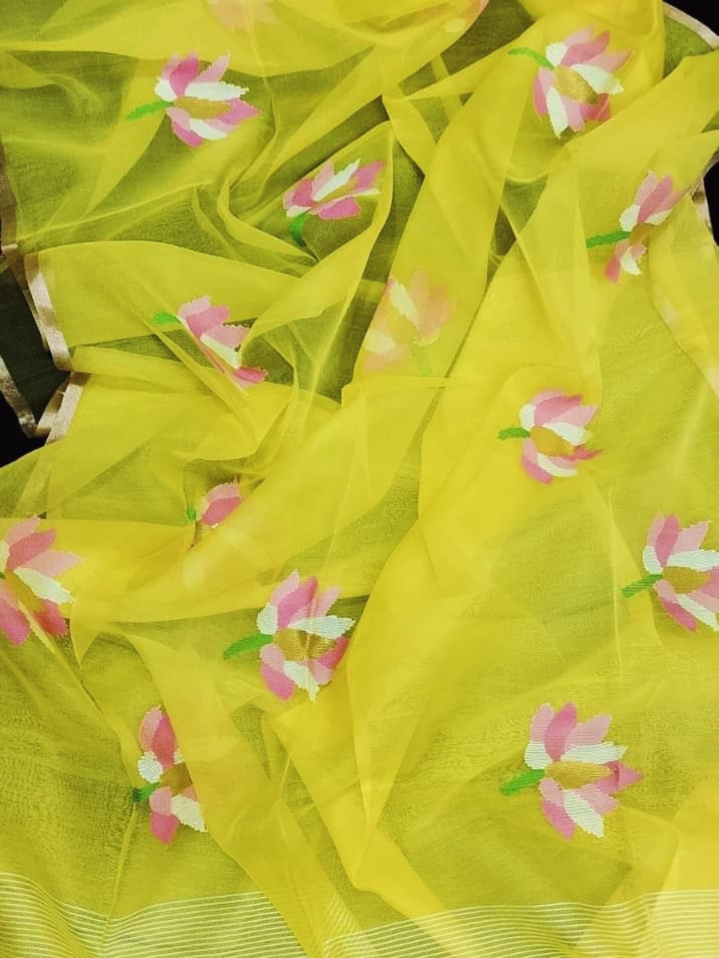 Nalina - Muslin Needle Jamdani Lotus Saree by Rihyaaz featuring handwoven lotus motifs on soft muslin fabric with intricate needle Jamdani craftsmanship.
