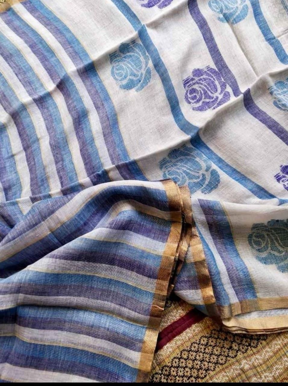 Rose handwoven striped linen saree with elegant woven stripes, rose motifs, and a lightweight traditional handloom texture by Rihyaaz 