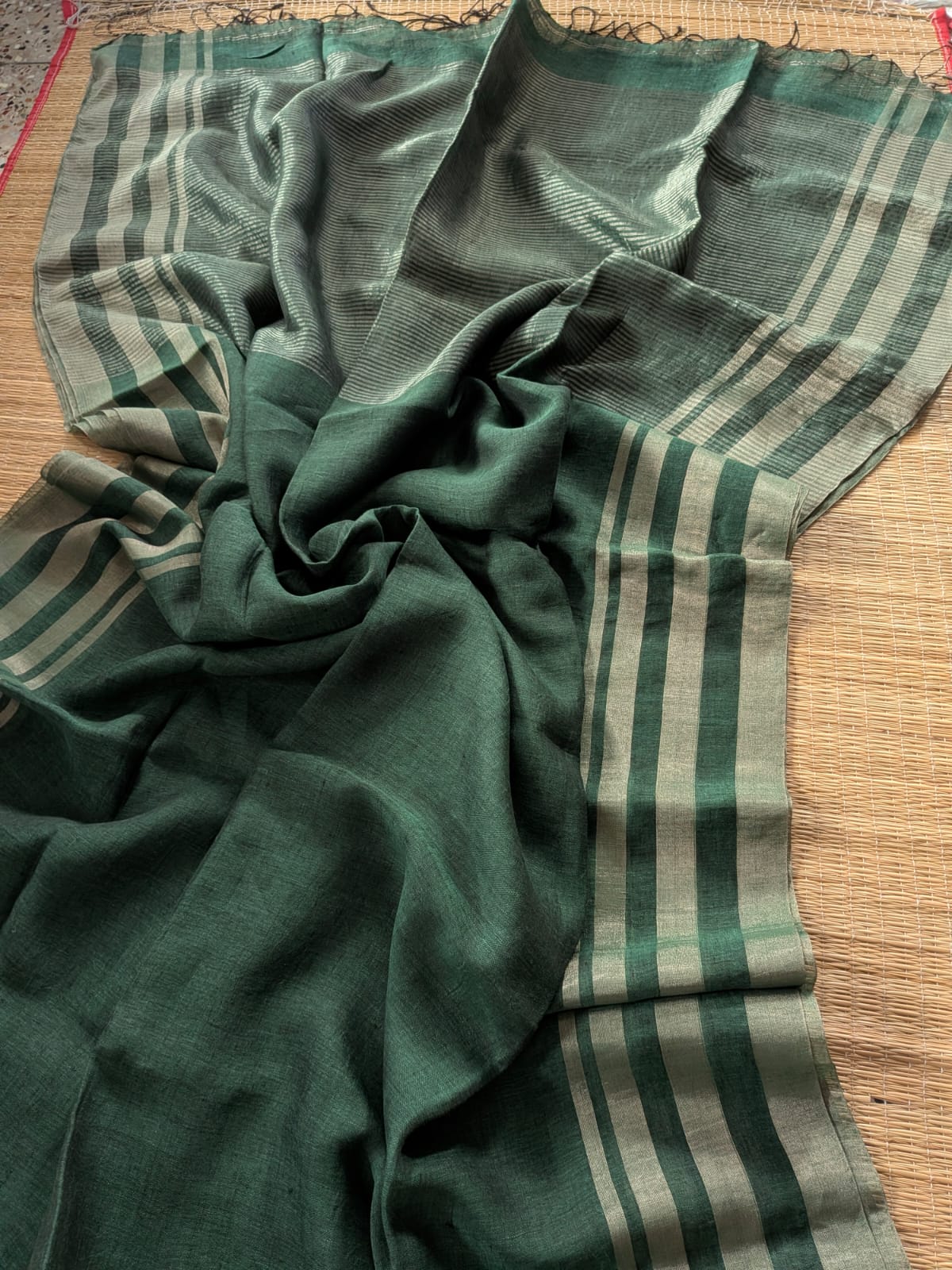 Dark green Pure 100-count Jayashree linen saree with tested zari double border on both sides and zari palla, including running blouse piece from Rihyaaz Fashions.