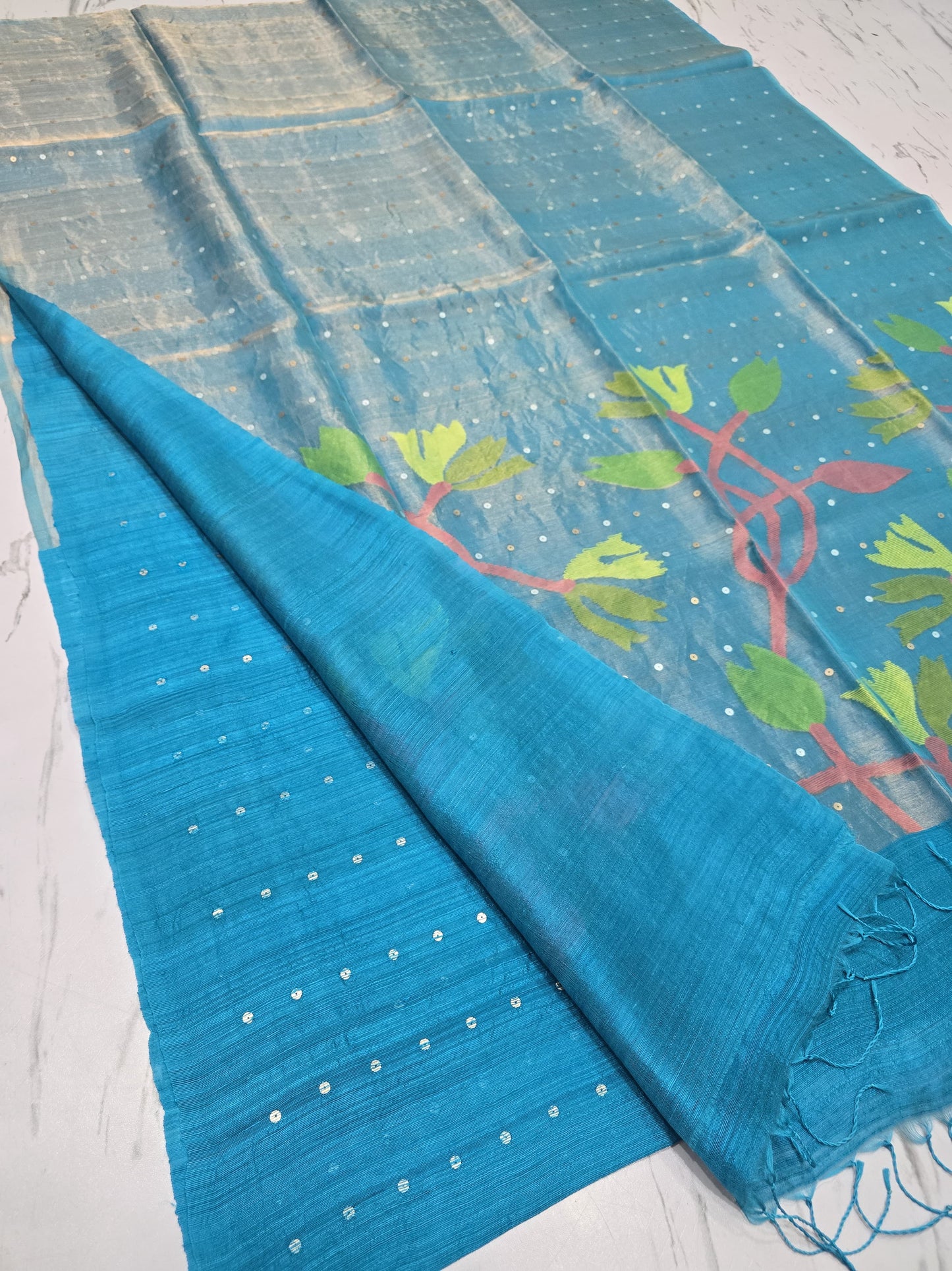 Raga sequin Matka saree with textured Matka body and elegant half tissue resham sequin Jamdani anchal. By Rihyaaz 